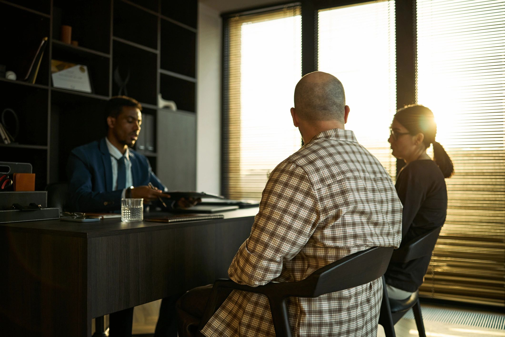 Advisor meeting with clients in a professional office
